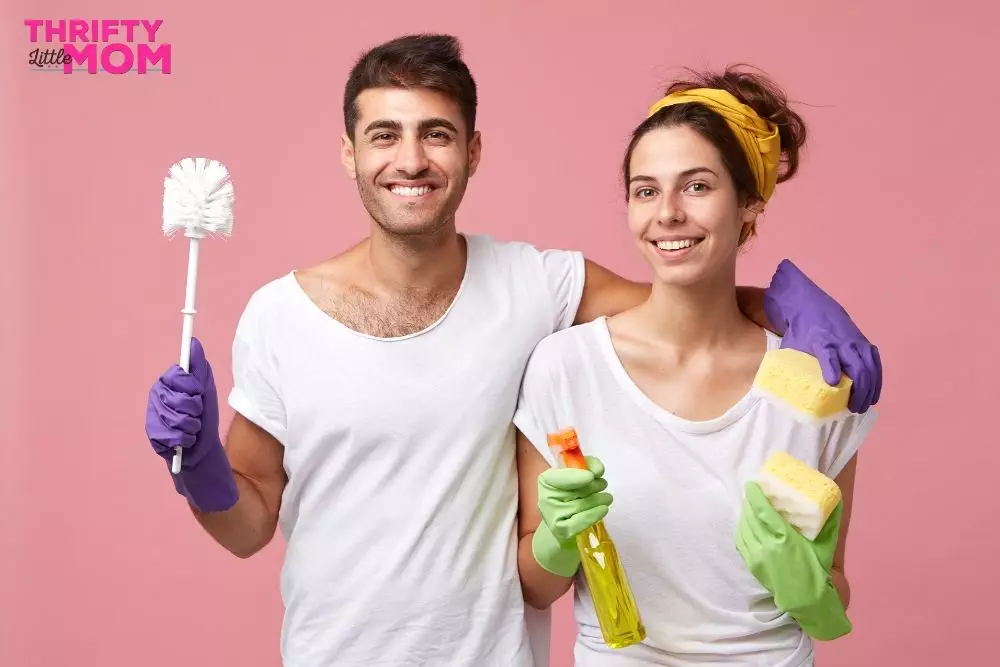 Couple with cleaning products