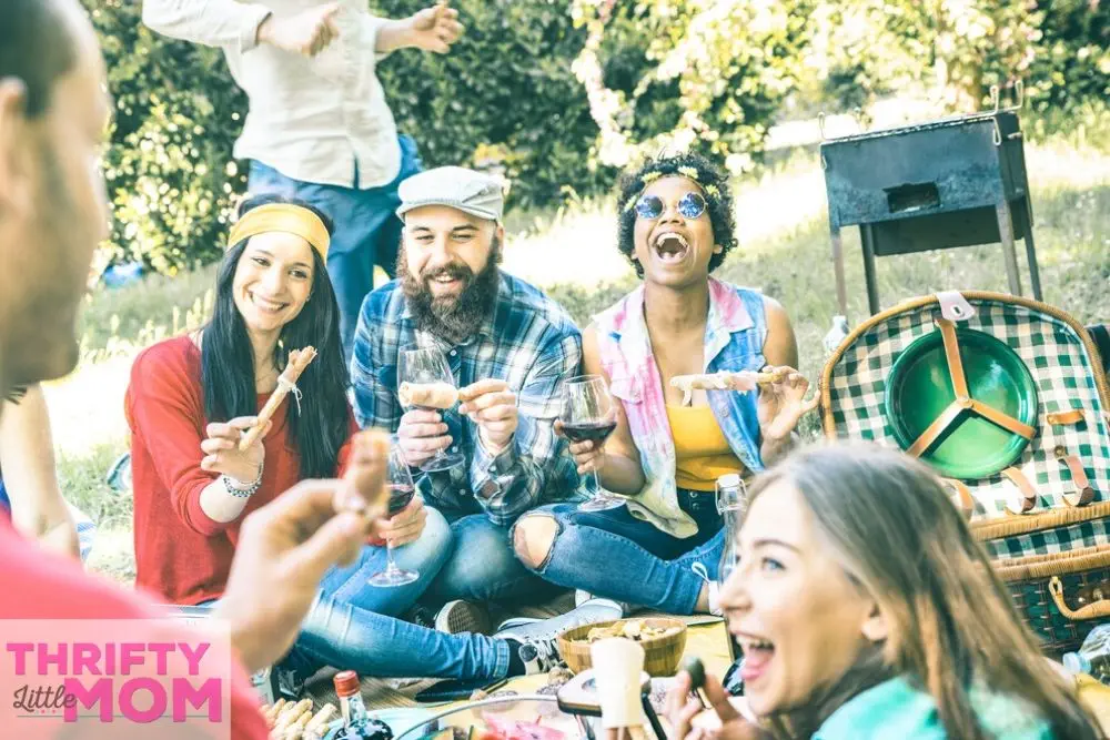 friends hanging at cookout for cheap birthday party idea